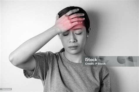 Black And White Young Woman With Of Stress And Headaches Stock Photo