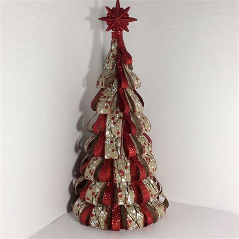 Christmas tree made with burlap ribbon printed with red