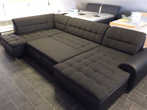 If you're looking for versatility, a sectional sofa is a smart choice. U-Shape Sectional "Edard" in Black PU Leather and Black ...