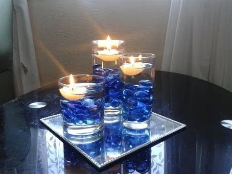 Now it's time to set up and decorate the vessels. beautiful centrepiece decoration using floating candles ...