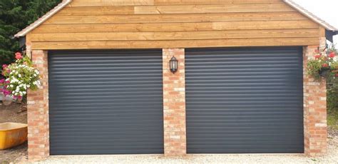 Set the roller back in the track. 2 Alluguard Roller Doors in Anthracite Grey Installed in ...