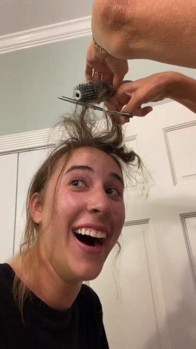 Woman Reacts Comically To Her Mom Chopping Off Her Entangled Hair In Roller Hairbrush Video