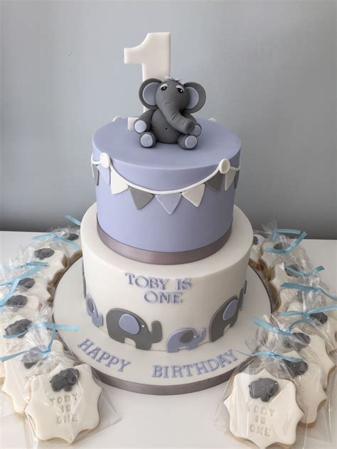 Browse through all of our designs today and pick your favorites. Two tier first birthday cake with elephant theme, blue, white and grey colour scheme and match ...
