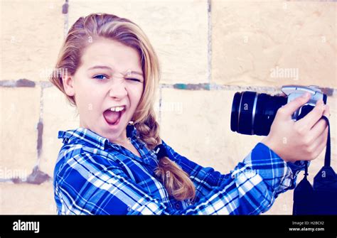 Girl Holding Camera Stock Photo Alamy