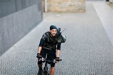 Bike Messenger In Urban Space By Stocksy Contributor Vegterfoto