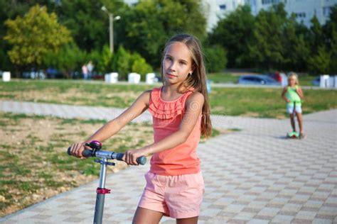 girl rides a scooter on street stock image image of physical rest 181735157