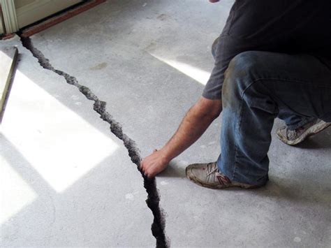 Patching cement on garage floor, thin repair on garage floor using quikrete, homedepot quikrete,fixing damage garage floor. Foundation Settlement & Structural Damage