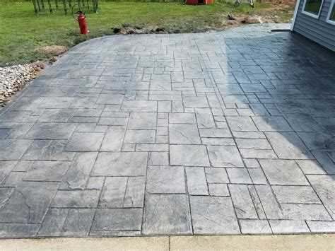 Black, charcoal, aztec brown & yukon gold stained stamped concrete walkway. Grand Ashlar. Gull grey color with Deep Charcoal release ...