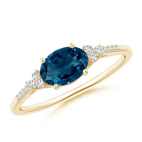 Horizontally Set Oval London Blue Topaz Ring With Diamonds Angara