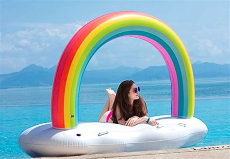 giant inflatable rainbow cloud pool float rainbow pool float popsugar home photo 2