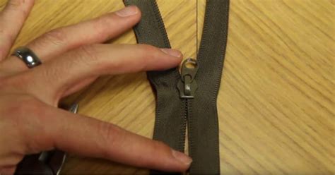 If you need to, use a small wire brush to scrub the zipper. Here's How to Fix a Broken Zipper in Mere Seconds! - DIY & Crafts
