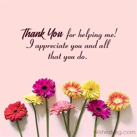 Flowers Are Arranged In Front Of A Pink Wall With The Words Thank You