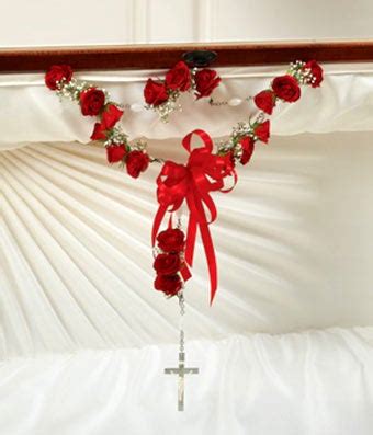 Sympathy flowers are usually a smaller arrangement. Small Rosary With Red Spray Roses at From You Flowers