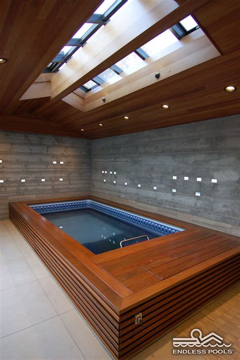 An Indoor Endless Pool Under Bright Skylights Indoor Pool Design