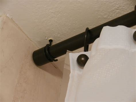 Drapery track such as ks or the standard 9000 is very low profile and allows you to if your curtain is not 10′ long then you need to make extenders or hang the rods from the ceiling via decorative chains or similar, like this shower. close up of end and hook in ceiling | Corner shower ...