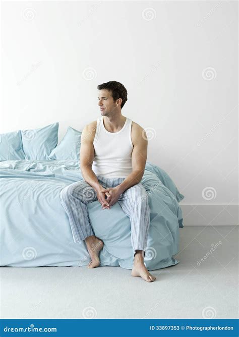 Thoughtful Man In Nightwear Sitting In Bed Stock Image Image Of Adult
