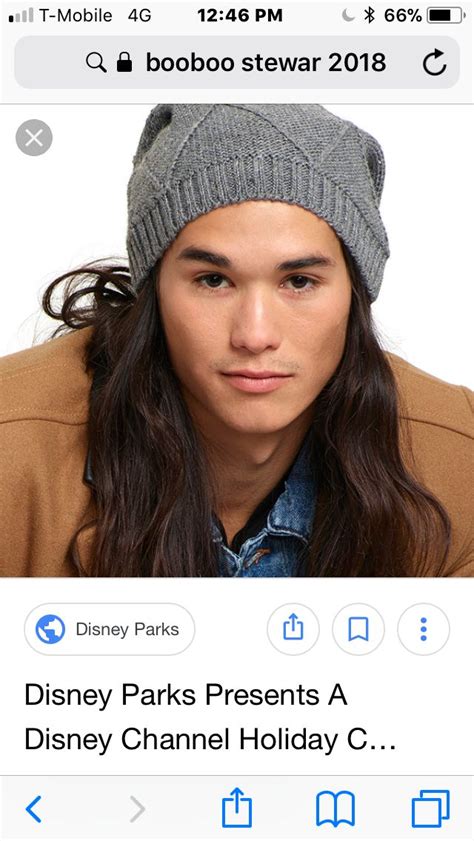 A Man With Long Hair Wearing A Beanie