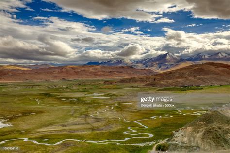 Scenic View Of Landscape Against Cloudy Sky High Res Stock Photo