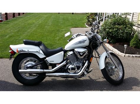 Cut up the old cobra exhaust, added tips, and wrapped them up. 2005 Honda Shadow Vlx 600 Motorcycles for sale