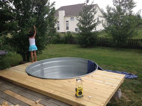 Perhaps a broken air compressor hose would work too. Galvanized Stock Tank Turned Into A Simple DIY Pool… - Eco ...