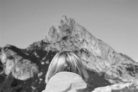 A Girl Looks At The Dolomites In Italy Back View Stock Photo Image