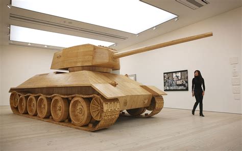 A Visitor Looks At Artist Amy Cheungs Full Size Wooden ‘toy Tank