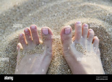 Close Up Of Toes In Sand Stock Photo Alamy