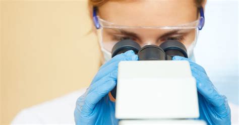 A doctor called a pathologist looks at the cells or tissue under a microscope to check for damage or disease. What is a biopsy?