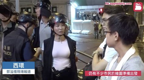 Lady In Hong Kong Police Vest And Helmet Becomes Main Attraction Of