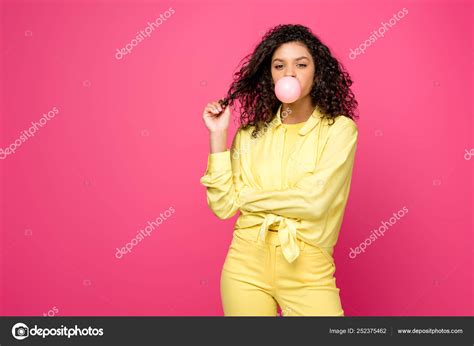 Attractive Curly African American Woman Blowing Bubble Gum Touching