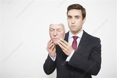 Businessman Holding Mask Stock Image F0079088 Science Photo Library