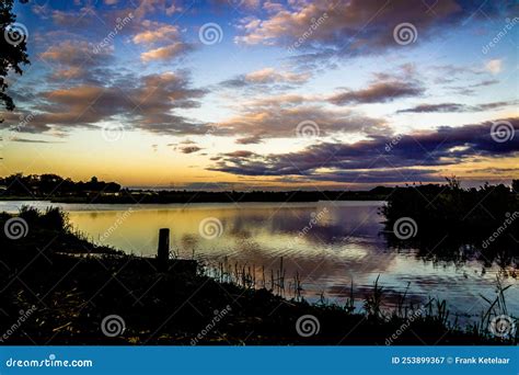 Landscape With Water Overcast Sky Sunset Colors Stock Image Image Of