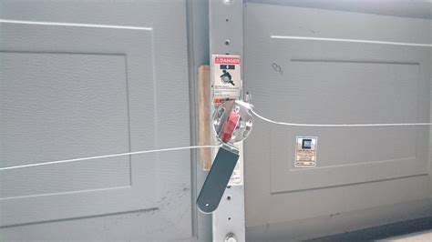 Use a zip tie to secure the garage door in place. Installing key lock and converting garage door to manual ...