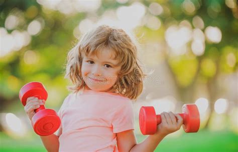 Kid Workout Child Exercising With Dumbbells Sporty Child With