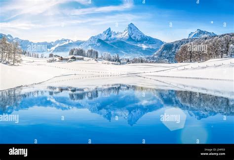 Panoramic View Of Beautiful White Winter Wonderland Scenery In The Alps