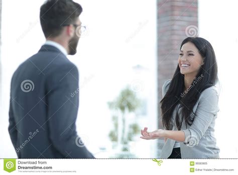 Business Woman Communicating With Colleague In The Office Stock Image