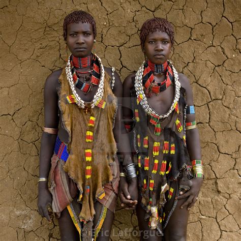 Portrait Of Two Hamar Tribe Women Posing With Traditional Necklace And