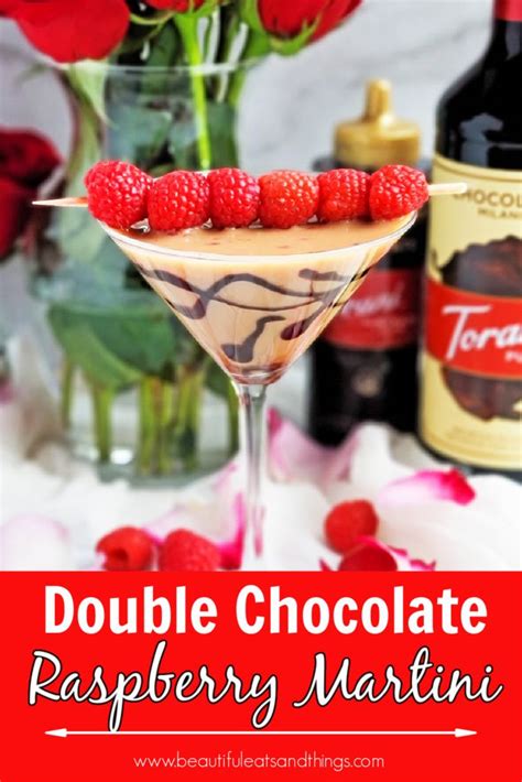 A Raspberry Martini Is Garnished With Fresh Raspberries And Chocolate