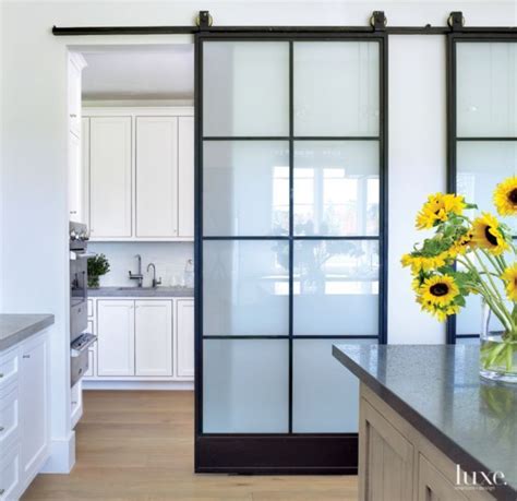 Some large sliding glass doors are small enough to replace a standard sized patio door, which are typically 6 feet wide, without removing a wall. Image result for sliding door at kitchen | Glass barn ...