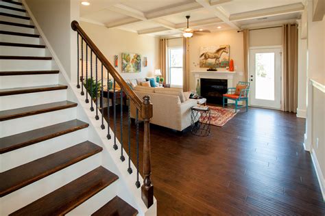 This cottage styled home offers an array of aesthetically pleasing architectural design features combining charm and character. Ballentine Model Home Family Room | Essex homes, Home, New ...