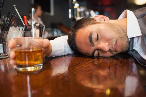 Premium Photo Drunk And Unconscious Businessman Lying On A Counter