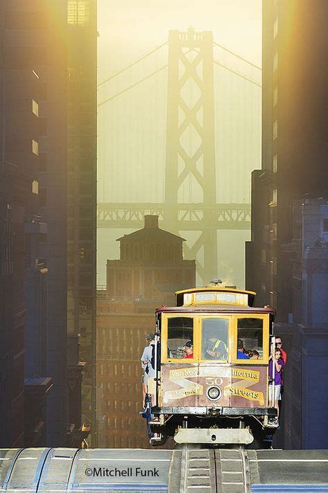 Cable Car At Sunrise With Bay Bridge In The Background San Francisco
