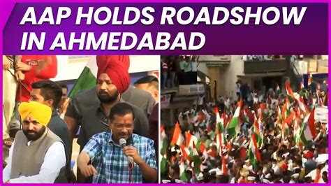 arvind kejriwal on a 2 day visit to ahmedabad holds roadshow along with punjab cm mann ian