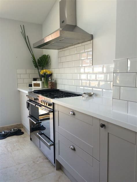 Take a look at this white kitchen with black worktop from beautiful kitchens for inspiration. Grey burford kitchen with White corian worktops and subway ...