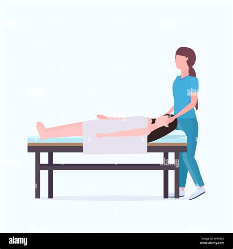 Woman Lying On Massage Bed African American Masseuse Therapist Doing Healing Treatment Massaging