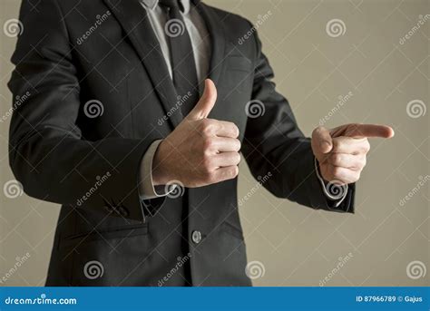 Businessman Giving A Thumbs Up Positive Vote To Show His Approval Stock