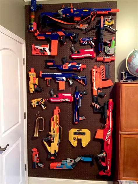 This is a cabinet i built to hold my nerf guns. We made this Nerf gun cabinet with 2 IKEA Besta shelf frames. The gun "holders" are acoustic ...