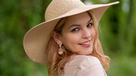 Smiley Girl Model Is Wearing Light Pink Dress And Big Hat Standing In