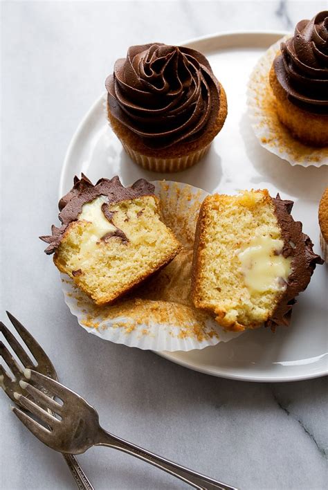 Line bottom of pan with parchment and grease parchment. Boston Cream Pie Cupcakes Small Batch | Dessert for Two