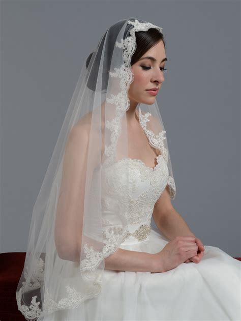 Wondering what makes a mantilla a mantilla? Mantilla veil fingertip/chapel alencon lace wedding veil V027
